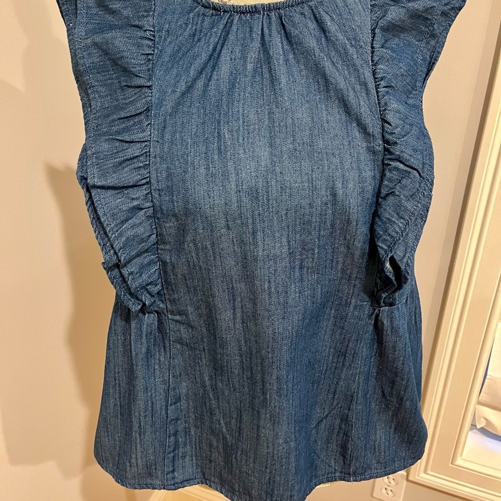 Chambray flutter sleeve top in new condition. Tags removed but never worn.